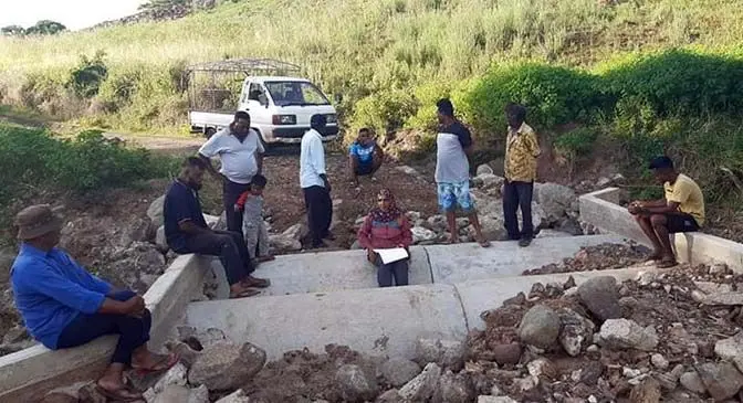 The farmers ready to work on repairing one of the damaged bridges in Nawai.