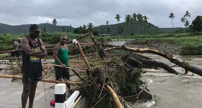  Lawaki Village headman Rupeni Ravenu (left) with Emosi Nage trying to figure out a way to clear the debris left by Tropical Cyclone Tino on Nakorotari Crossing, Labasa, on January 18, 2020. Photo: Laisa Lui 
