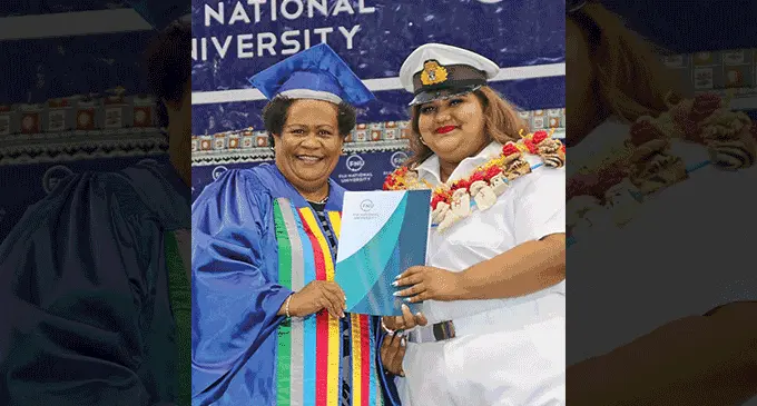 Fiji National University graduate Monisha Shivani Prasad receives her certificate from Professor Unaisi Nabobo Baba during the graduation ceremony.