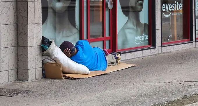 Homeless people sleeping on the streets.
