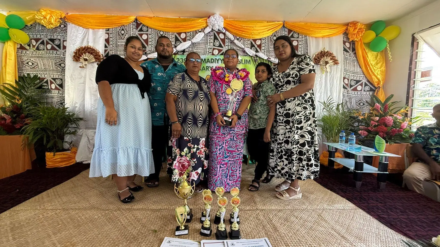 Shahinah Nisha with her family during the Ahmadiyya Primary School annual graduation ceremony on December 1, 2025.