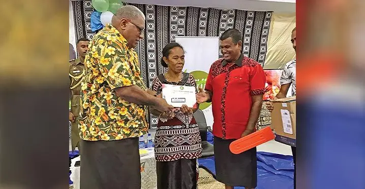 President Ratu Wiliame Katonivere handover certificate to Mere Vakalele and Rishi Ram during the Fiji Rice Pte Limited’s President’s awards for farmers night at the Fiji Football Academy in Labasa on March 4, 2023. Photo: Shratika Naidu
