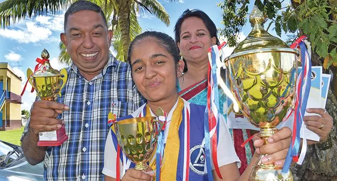 One of the two Bhawani Dayal Arya College dux award recipient Anjlin Lal with parents Devi Lal and Madhu Lal following the school’s annual prizegiving ceremony on December 2, 2020. Photo: Ronald Kumar