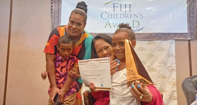 From left: Maraia Gonerogo (Laisiana’s mother), Navitalai Gonerogo (Laisiana’s brother), Minister of Women, Children And Poverty Alleviation, Rosy Akbar, and Laisiana Gonerogo at the Fiji Children’s Award at Holiday Inn, Suva on November 18, 2022. Photo: Jone Salusalu