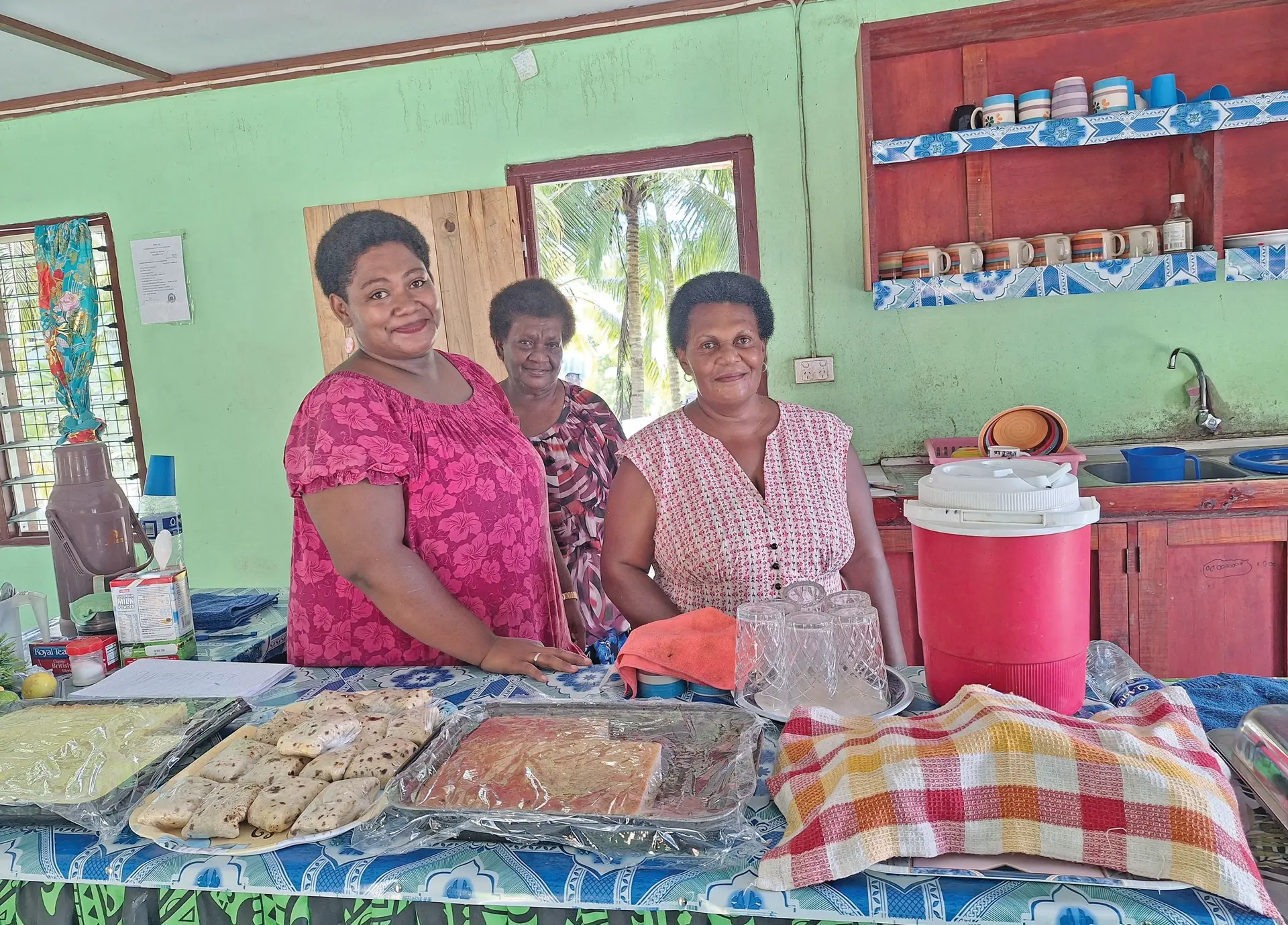 From left: Alesi Siqa, Joana Nalivono and Ulamila Ranadi with prepared meals at Semo Village in Nadroga.