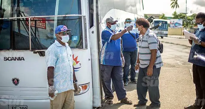 Sun Beam bus conductors observing COVID-19 measures with their passengers. Photo: Leon Lord