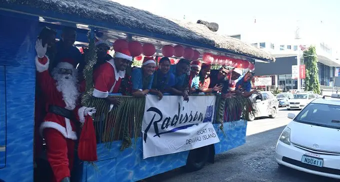 Staff of the Radisson Blu Resort Fiji on board the Bula Bus on the main street of Nadi Town. Photo: Waisea Nasokia