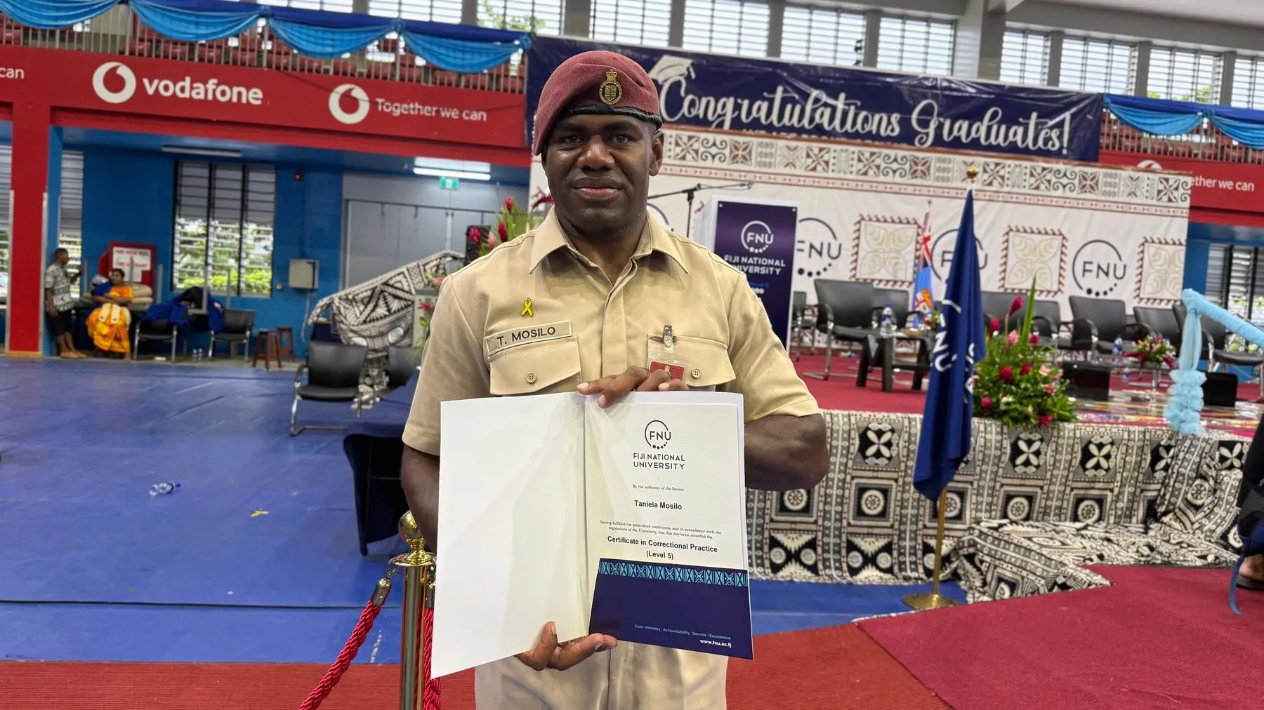 Fiji Corrections Service officer Taniela Mosilo proudly displays his Certificate IV in Correctional Practices from Fiji National University during the graduation ceremony at Vodafone Arena, Laucala, on December 9, 2025.