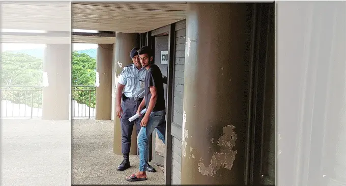 Mohammed Imran Yunus escorted by police out of the Magistrate’s Court in Lautoka on March 7, 2024. Photo: Salote Qalubau
