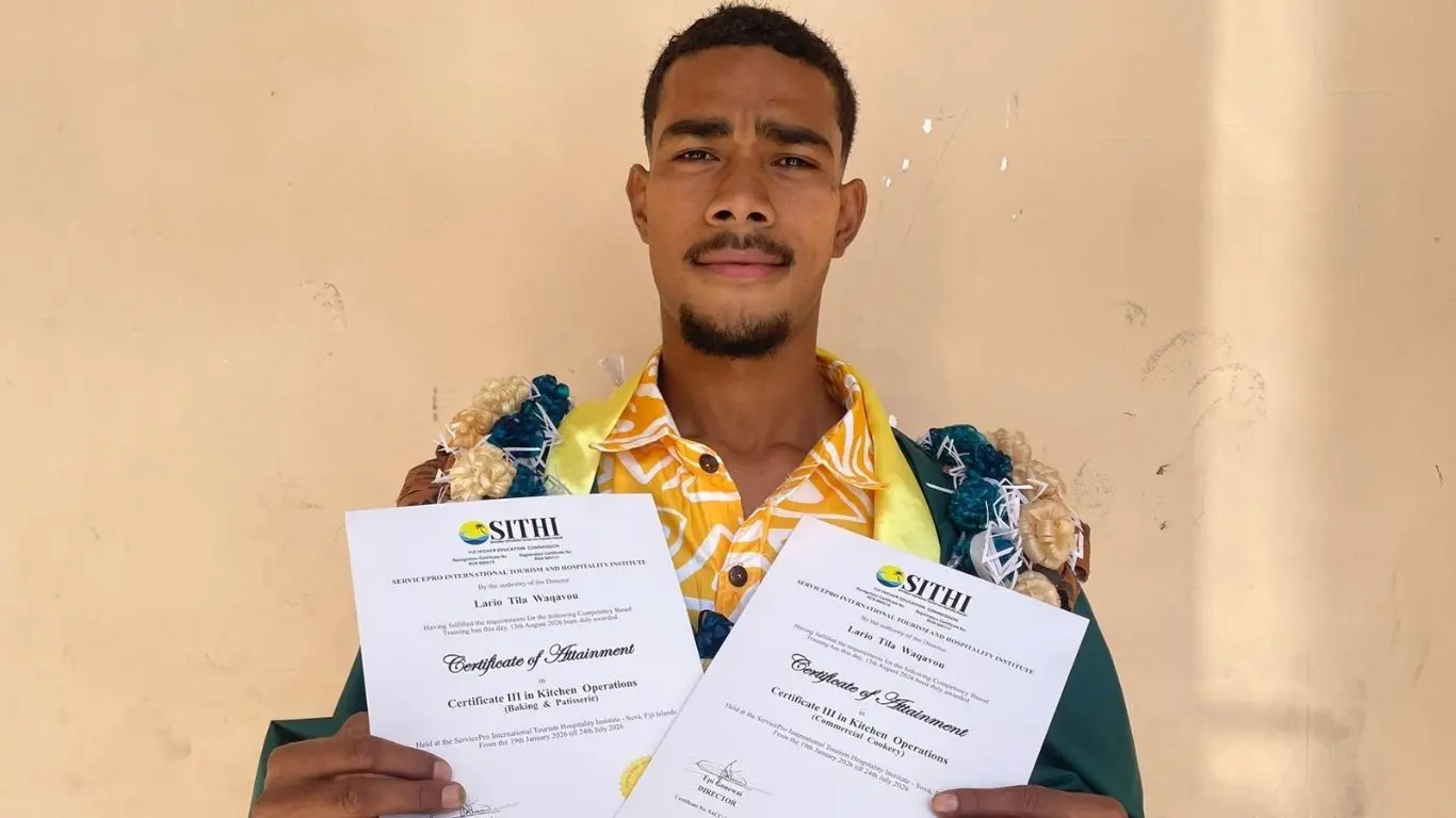 Lario Tila Waqavou with his certificates after graduating from ServicePro International Tourism Hospitality Institute in Suva with a Certificate III in Kitchen Operations on August 13, 2026.