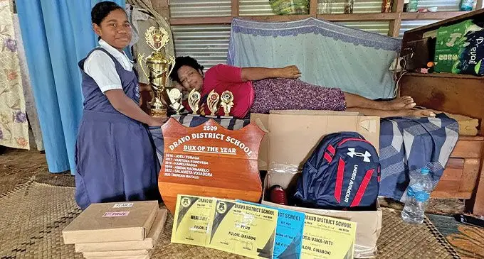 Dravo District School Dux Fulori Diraboki, 13, with her bedridden mother Timaleti Droceva at their home in Naila Village, Tailevu on November 29, 2024.  PHOTO: Kelera Tuisawau