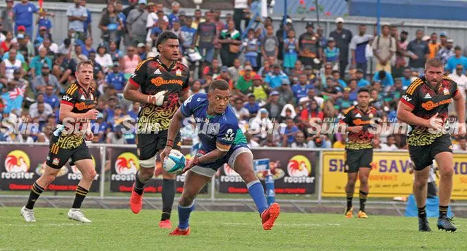 From left: Chiefs captain and halfback Brad Weber and lock Tupou Vaa’i keep an eye on Swire Shipping Fijian Drua first five eight Teti Tela as he sets his backline in motion during their Super Rugby Pacific clash at Churchill Park, Lautoka, on May 28, 2022. Photo: Waisea Nasokia