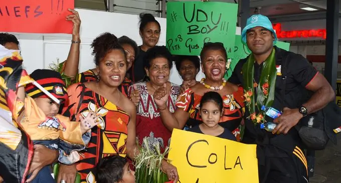 Fijian born Chiefs flanker Pita Sowakula (right) with family and fans at Nausori International Airport on June 27, 2018. Photo: Ronald Kumar.