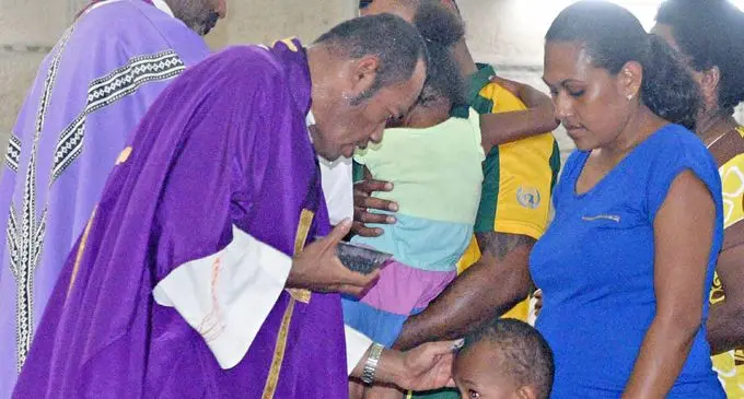 Lemeki Tuikubulau receives the sacramental ashes during an Ash Wednesday celebration at the Sacred Heart Cathedral yesterday.Photo:Vilimoni Vaganalau.