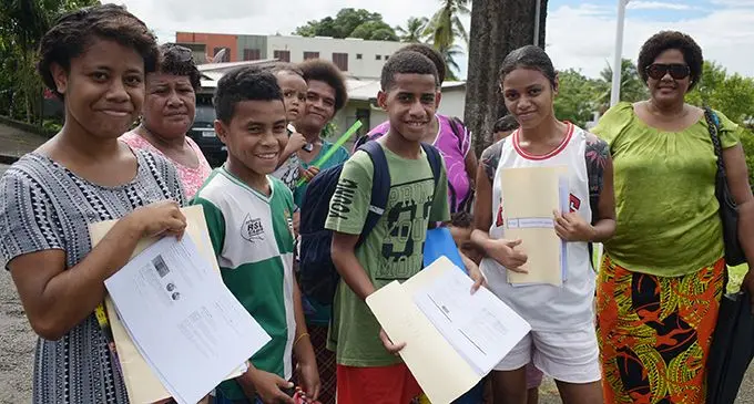 Suva Sangam High School students with their parents after collecting their school supplementary  activities material on May 4, 2020.  Photo: Ronald Kumar