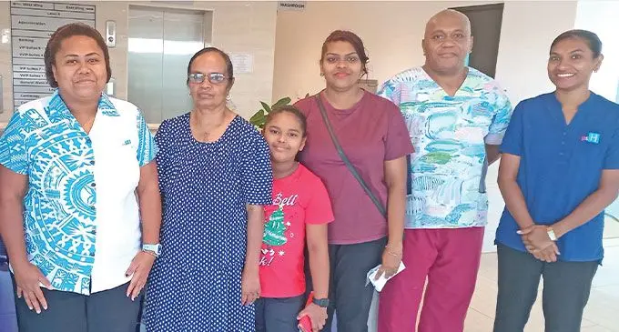 Pacific Specialist Healthcare’s first open-heart surgery patient Kusum Lata (centre with brown dress) with family members and PSH staff after her review yesterday. Photo: Charles Chambers