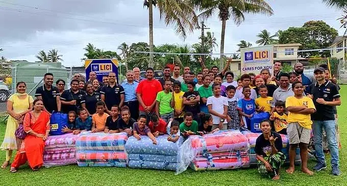 Staff and management of LICI with children and staff of Harland Hostels in Dhanji Street, Suva with donations provided by LICI. Photo: Life Insurance Corporation of India
