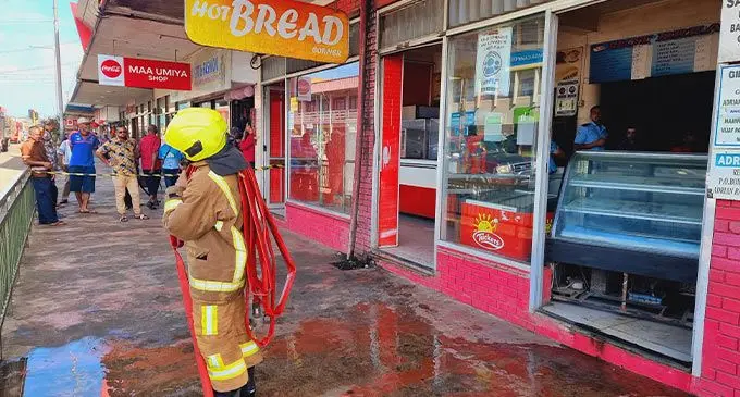 National Fire Authority (NFA) officers trying to control the fire at Hot Bread Corner bakery shop in Labasa Town on August 3, 2022.  Photo: Sampras Anand