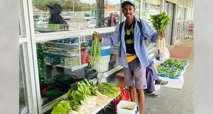 Avikash Lal with his produce placed in front of New World Super IGA at Votualevu roundabout.