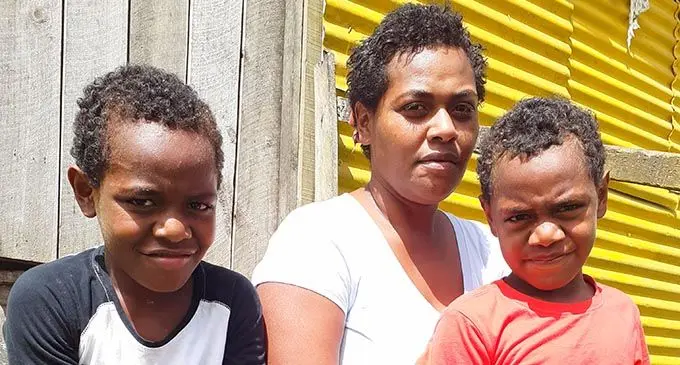 Widow Sisilia Domuwai of Naimasimasi Village, Serua with two of her four children Waisale Roko and Rupeni Vocea on August 30, 2021. Photo: Ronald Kumar
