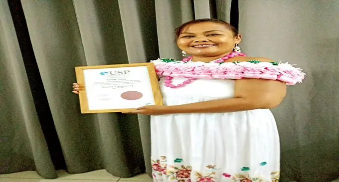 Kelinda Dame Tsiode with her Diploma in Accounting certificate from the University of the South Pacific.