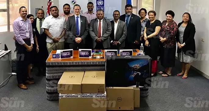 UNDP Pacific Office in Fiji Resident Deputy Representative Kevin Petrini, Minister for Defence, Disaster Management and Rural and Maritime Development Inia Seruiratu and Permanent Secretary David Kolitagane with staff of the UNDP Pacific Office in Fiji and Ministry for Rural and Maritime Development during the handover on March 8, 2021. Photo: Inoke Rabonu