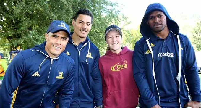 From left:  Aaron Smith, Patelesio Tomkinson and Waisake Naholo of the Highlanders pose for a photo when handing out Highlander flags to supporters as part of the Super Rugby promotion in Queenstown, New Zealand.  Photo: Zimbio.