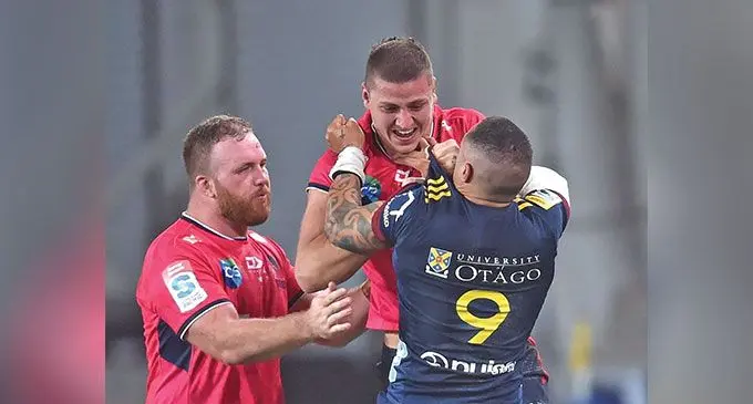 Highlanders halfback Aaron Smith tussles with Rebels lock Josh Canham at Forsyth Barr Stadium on May 20, 2023. Photo: Peter Mcintosh