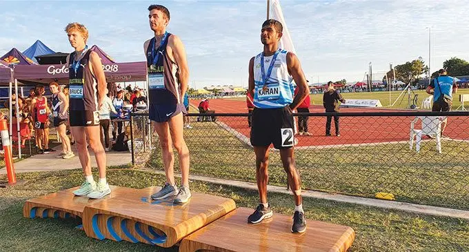 From left; Australia’s Sam Mcentee, Jack Bruce and Yeshnil Karan of Fiji on the medal podium after the 5000m final of the Oceania Championship in Mackay, Australia. Photo: Athletics Fiji.