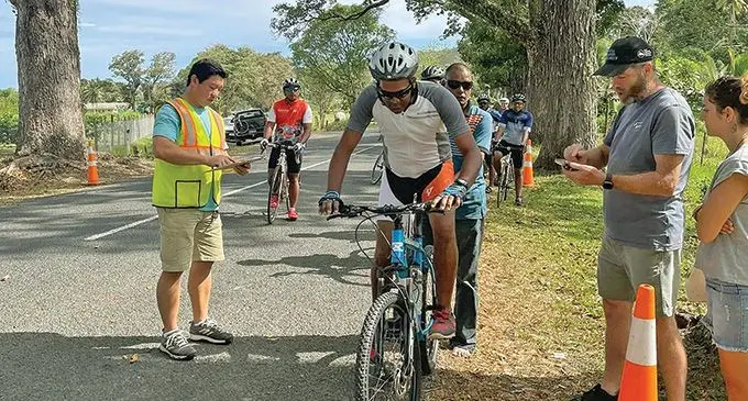 Cycling Fiji Championship 2022 at Sigatoka valley. Inset right: Qaqi Mai Bike Share Fiji founder, Eliki Dakuitoga. Photos: Théo Dumanchin (Facebook)