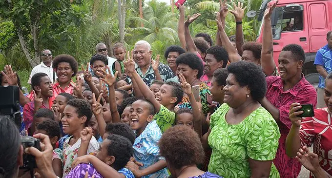 Prime Minister Voreqe Bainimarama surrounded by children and elders of the three villages along the Kiuva Kaba Road.  Photo: Ronald Kumar