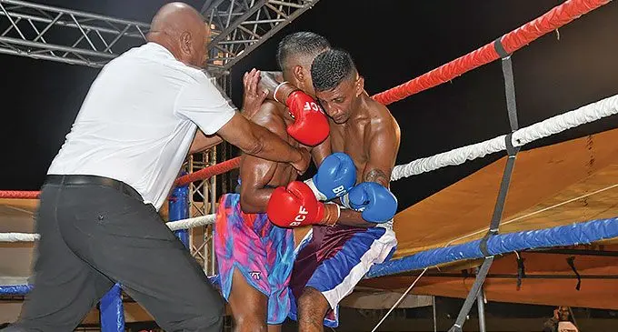 Krishnil Mudaliar (right) being attacked by Junior Binnu Singh during the WBF (World Boxing Foundation) Australasian featherweight title at Lawaqa Park, Sigatoka, on Saturday.