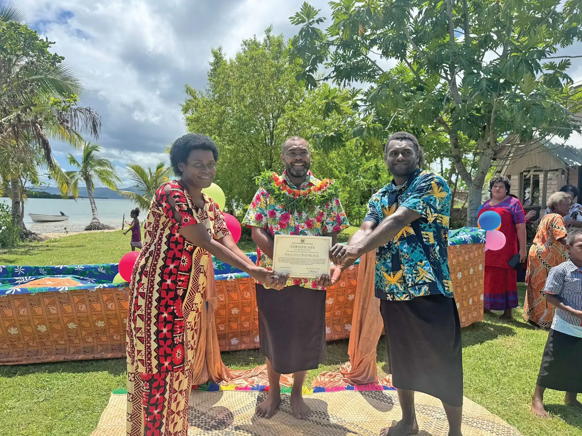 Minister for Environment and Climate Change, Mosese Bulitavu, and former President Ratu Wiliame Katonivere with members of Macuata-i-Wai Village. Photo: Fiji Government