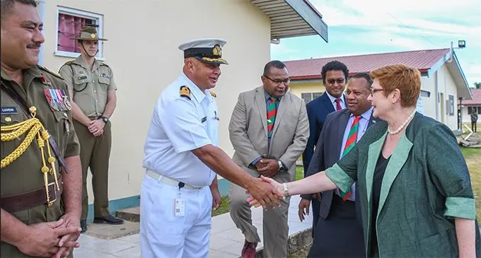 Australian Foreign Affairs Minister Marise Payne is greeted by the Republic of Fiji Military Forces Acting Chief of Staff Captain (Navy) John Fox at Black Rock Camp in Nadi. Photo: DEPTFO