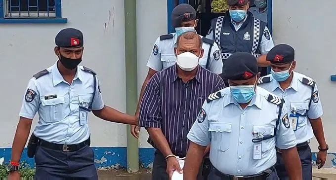 Maika Bavou is escorted by Police officers to the Rakiraki Magistrates Court on August 17, 2022. Photo: Salote Qalubau.