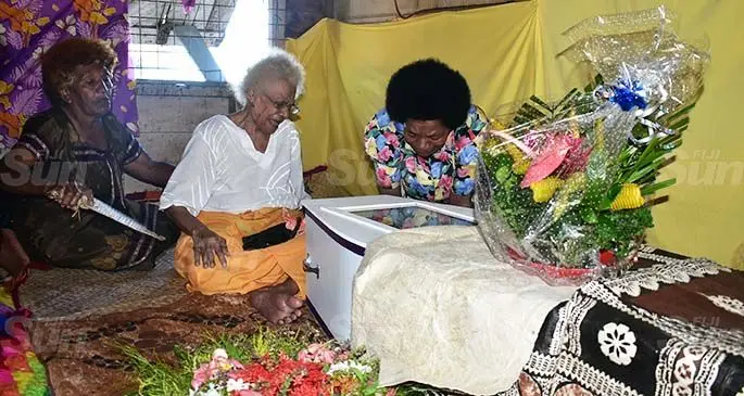 Latileta Marama Vulovulo (middle) with family members during the funeral of Jone Masirewa at their Natokowaqa home in Lautoka on April 20, 2020. Photo: Nicolette Chambers