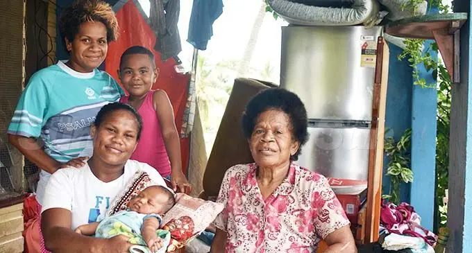 Good samaritan Arieta Vueti, 32 ( standing back left), with their new family at Navo, Nadi on October 29, 2020. Photo: Waisea Nasokia