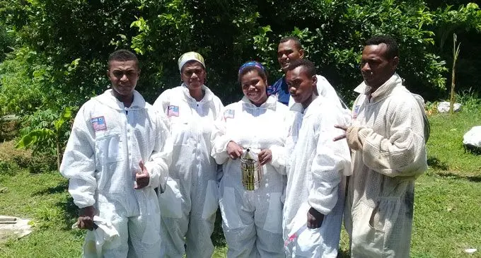 Youth club members in their bee keeping attire.