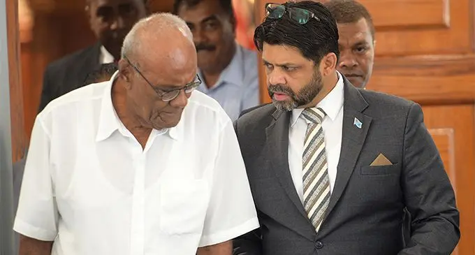 Attorney General and Minister for Economy Aiyaz Sayed-Khaiyum with Penisoni Saukelea outside Parliament yesterday. Photo: Ronald Kumar.