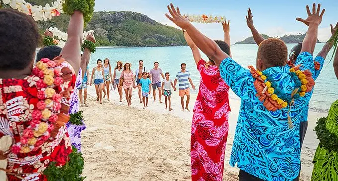 Tourists being welcomed by locals.