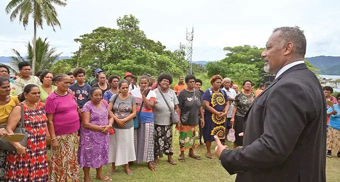 Minister for Rural, Maritime Development and Disaster Management Sakiasi Ditoka (right), with market vendors during a live tsunami drill exercise in Savusavu on March 23, 2023