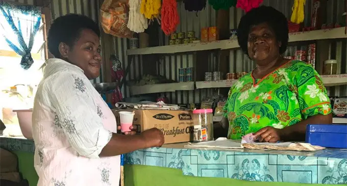 From left: Vasemaca Toga serving a customer at her canteen in Nativi, Ra. Photo: Ministry of Industry, Trade and Tourism