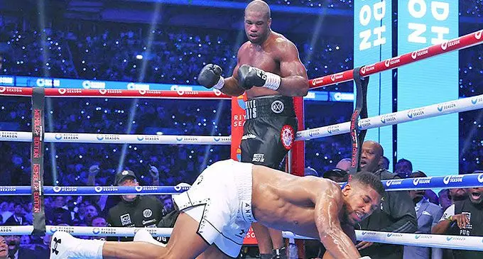 Daniel Dubois puts Anthony Joshua to the canvas in their International Boxing Federation world heavyweight title fight at the Wembley Stadium in London on September 21, 2024. Dubois retained the IBF title with a fifth round knockout win. Photo: DAZN