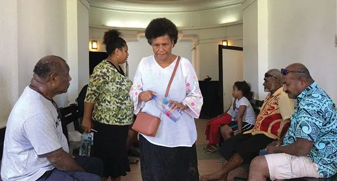 Niko Nawaikula’s wife Miliakere Nawaikula (in white top) outside the High Court in Suva, on April 14, 2022.  Photo: Ashna Kumar