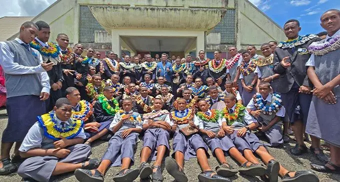 Minister for Education Aseri Radrodro joined newly elected student leaders of Ratu Kadavulevu School in Lodoni, Tailevu, outside the school chapel on February 16, 2025 after 92 student leaders were badged and reminded of their responsibilities to the school. Photo: Sosiveta Korobiau.  