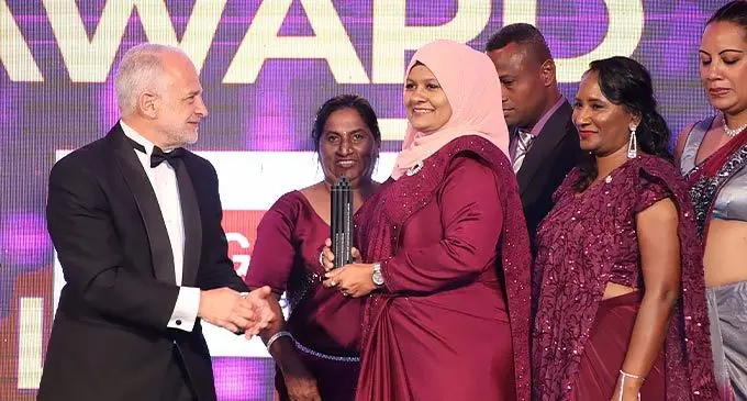 Fiji Business Excellence Awards chairman Mark Halabe gives out the Prize award to Flick Hygiene Limited on November 5, 2022. Photo: Sosiveta Korobiau