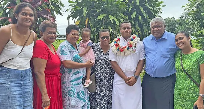 Marist Brother High School head boy Isoa Dakunimata (with garland), and his family.