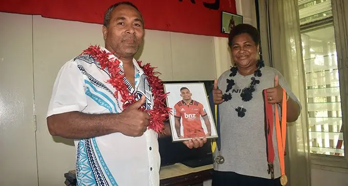 Canterbury Crusaders winger Sevuloni Reece’s parents, William and Amelia Reece, with a portrait of their most wanted son at their home in Namaka, Nadi,  on April 28, 2019.  Photo: Rohit Kumar