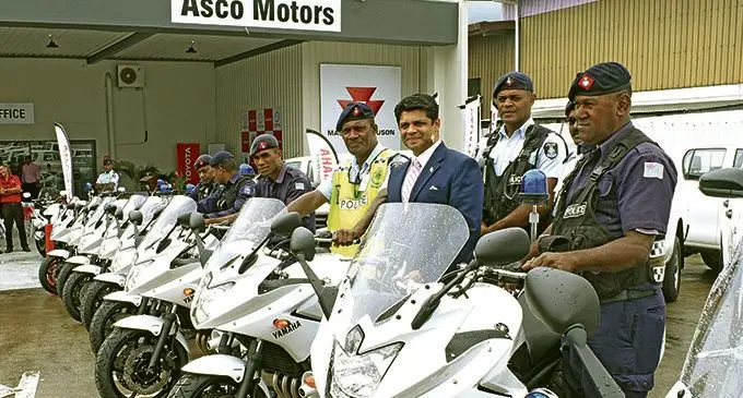 Acting Prime Minister and Attorney General Aiyaz Sayed-Khaiyum with Police traffic officers after receiving 30 motor-cycles for Police from Asco Motors on February 27, 2018. Photo: Ronald Kumar.