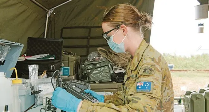 An Australian Army Environmental Officer tests water from the water purification plant in Vanua Levu ahead of distribution by the Republic of Fiji Military Forces.   Photo: Australian High Commission